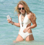 Wears a stylish cut out white swimsuit in Barbados 3112 1