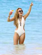 Wears a stylish cut out white swimsuit in Barbados 3112 2
