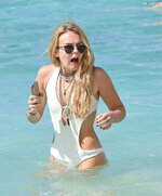 Wears a stylish cut out white swimsuit in Barbados 3112 5