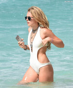 Wears a stylish cut out white swimsuit in Barbados 3112 7