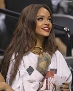 Sexy Rihanna in shorts watching an NBA game 3 825x1024