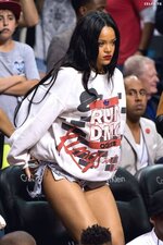Sexy Rihanna in shorts watching an NBA game 4