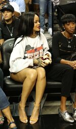 Sexy Rihanna in shorts watching an NBA game 8 768x1291