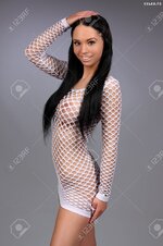 22076044 sexy busty girl in a white net skirt Stock Photo