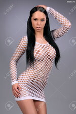 26860215 sexy busty girl in a white net skirt Stock Photo