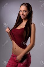 20764424 sexy busty young girl posing in a red shirt and a jeans Stock Photo