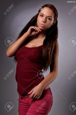 24668446 sexy busty young girl posing in a shirt and a jeans Stock Photo