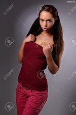 24668448 sexy busty young girl posing in a shirt and a jeans Stock Photo