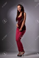 24668479 sexy busty young girl posing in a shirt and a jeans Stock Photo