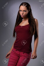 34930781 Sexy busty young girl posing in a red shirt and a jeans Stock Photo